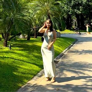 Sage maxi dress with top pleated detailing and lace-up strappy back!